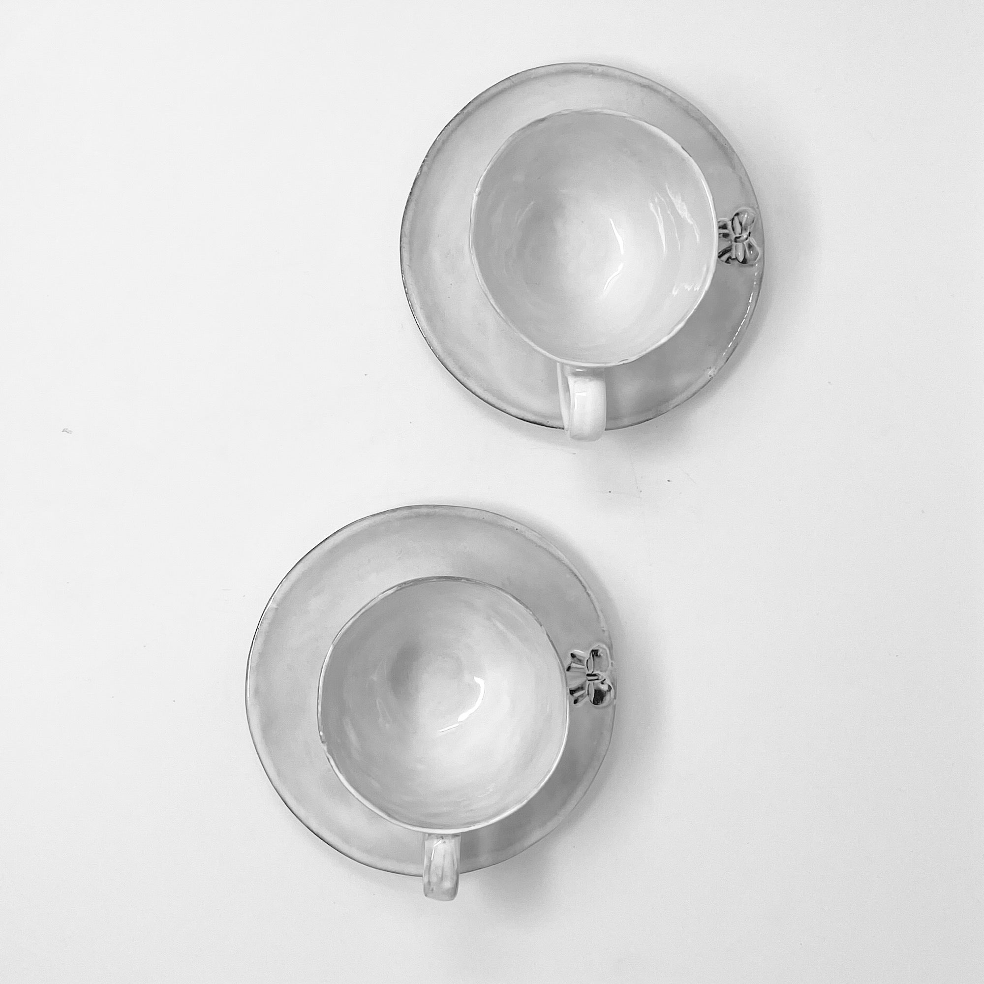 2x Cups and saucers set